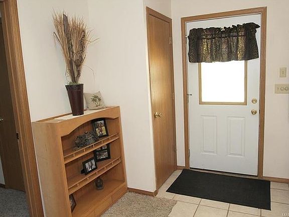 Entry with coat closet and ceramic floor