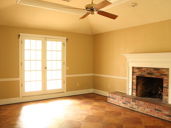 Sunken Living Room with trey ceiling and fireplace