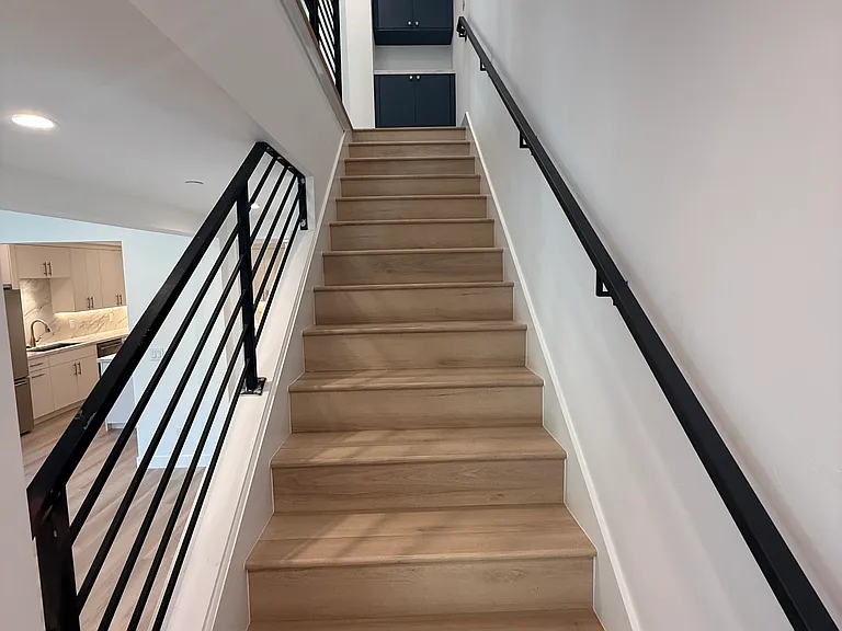 Stairs with custom railing throughout