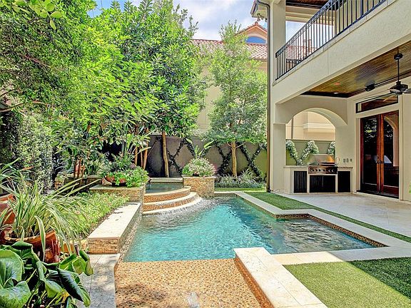 The outdoor kitchen is well placed and great for year-round enjoyment, rain or shine!