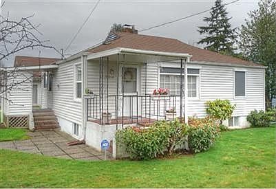 Daylight basement home with fully fenced lot sits on corner lot!