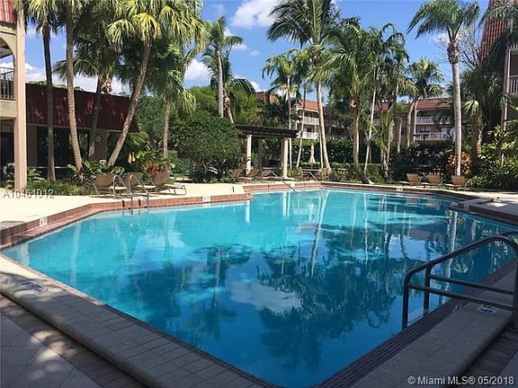Large pool with beautiful landscape and barbecue area.
