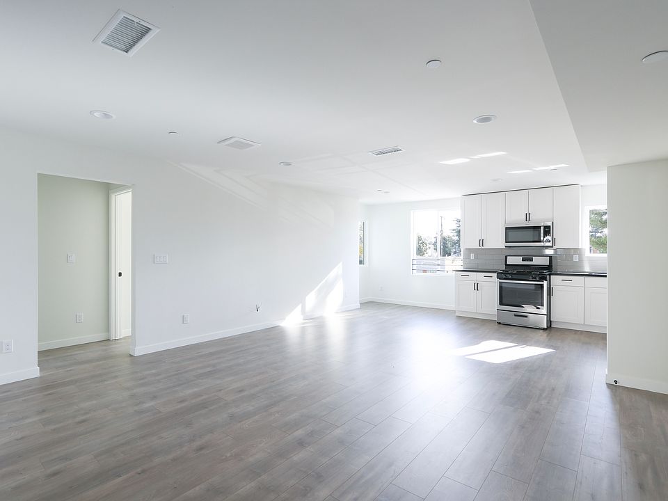 Room for an island, table, full living room, and whatever you might want to put in all this space!