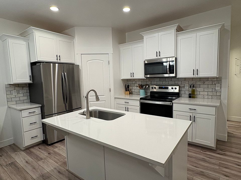 Modern kitchen with quartz countertops and large island