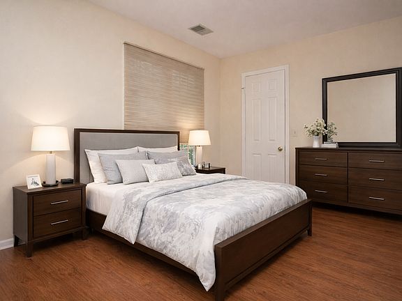 Bedroom w/ walk-in in closet virtually staged