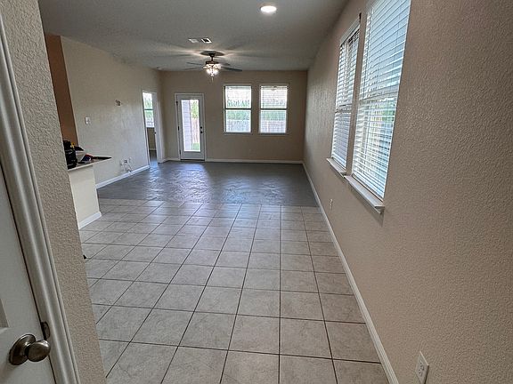 Tile and Stained concrete throughout. No Carpet!