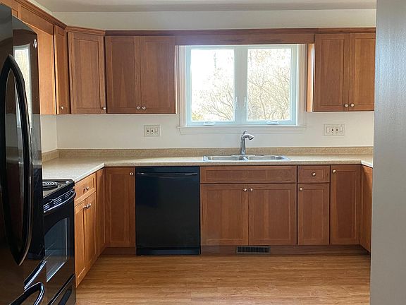 Full size 3-door fridge, electric coil stove/oven, microwave, dishwasher and stainless steel sink.
