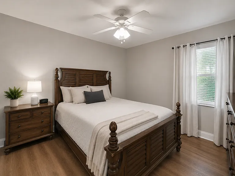 The master bedroom features spacious dimensions, luxury vinyl plank flooring, and ample natural light