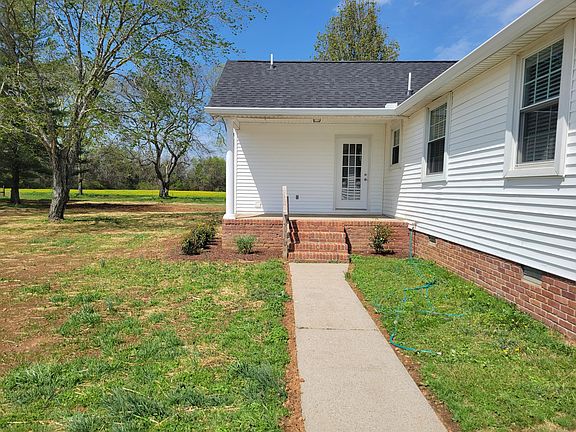 The back porch with entry into home.