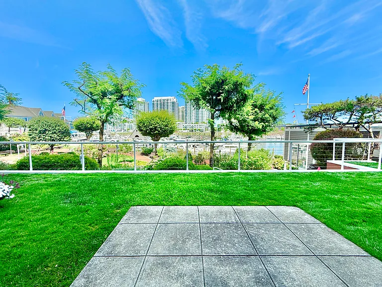 Patio overlooks green to water