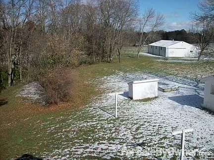 The back yard and shop / barn
						:
						The view from upstairs facing North.