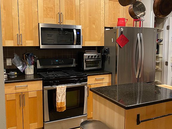 kitchen with new microwave and refrigerator