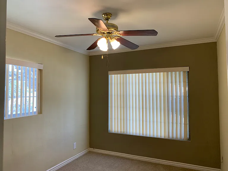 Older photo. Bedrooms are now hard flooring. The same as Living room.