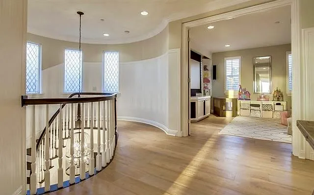 Second floor view of stairs and fully equipped theater room