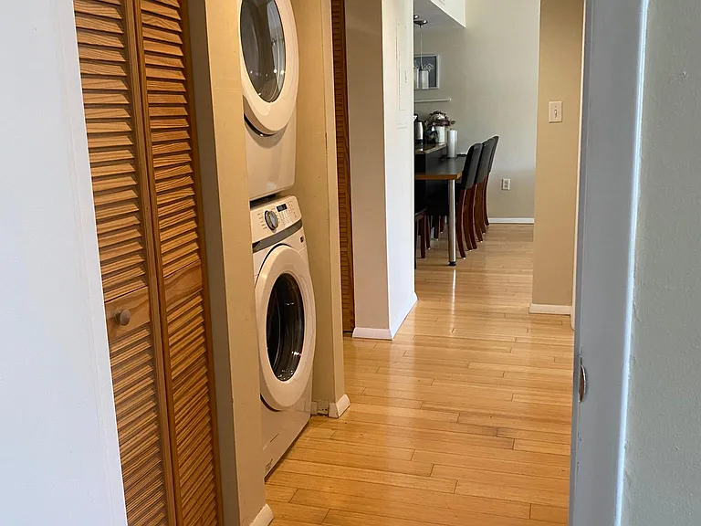Hallway with new washer and dryer