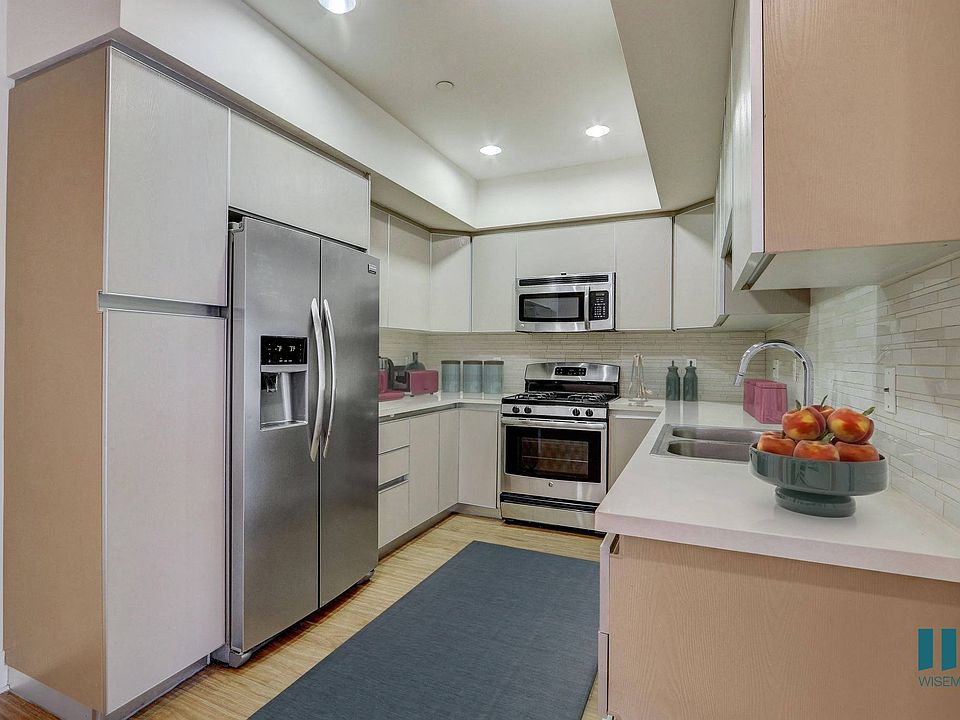 Full-Size Kitchen with Stainless-Steel Appliances and Ample Cabinet Storage
