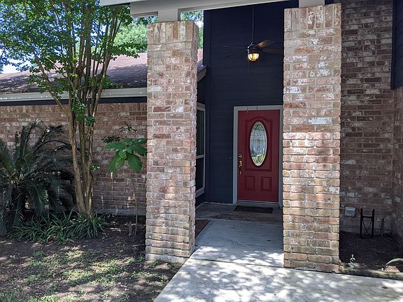 A view of the beautiful shady covered front porch as you approach the front door.
