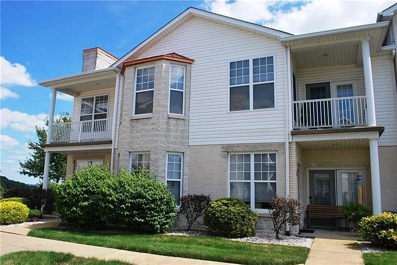 Welcome to 240 Unit 8.  1st floor condo with covered patios off the living room and kitchen.  Backs to wood with beautiful view.