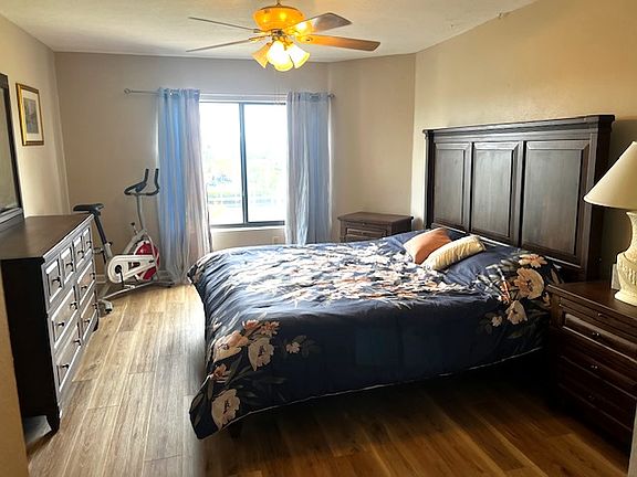 View of bedroom with stationary bike