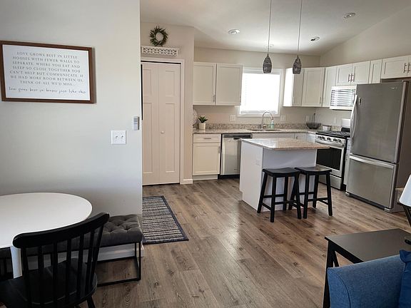Vaulted ceilings in living/dining room and kitchen.