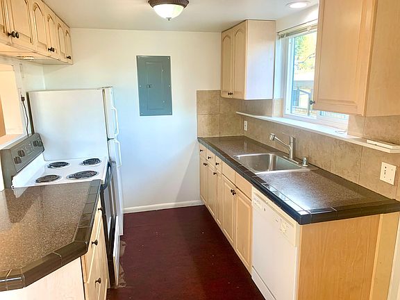 Lots of cabinet storage and single sheet marmoleum floors that are clean looking and easy to maintain.
