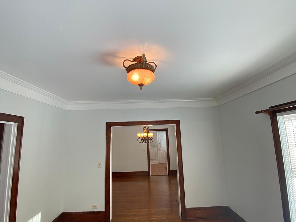 Living room looking into dining room and kitchen