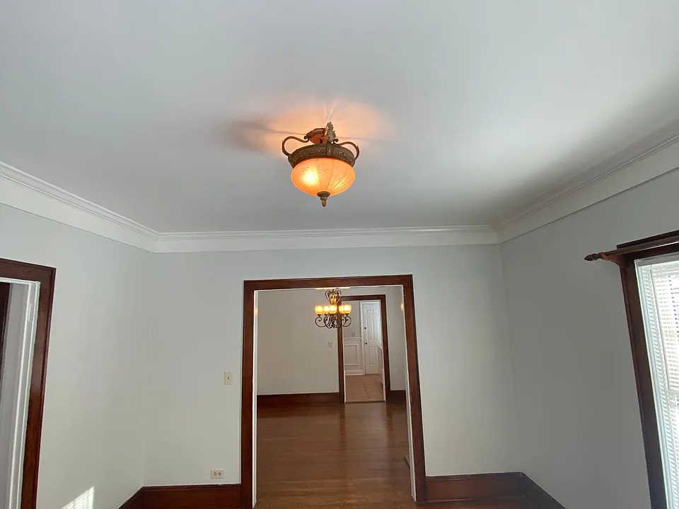 Living room looking into dining room and kitchen