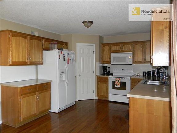 Spacious kitchen with newer appliances, ample cabinetry, cabinet space and pantry.