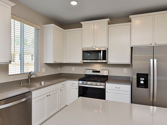 The chef ready kitchen comes with stainless steel appliances and granite countertops
