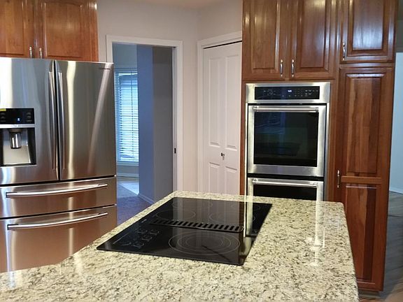 kitchen island with Jenn-aire cooktop