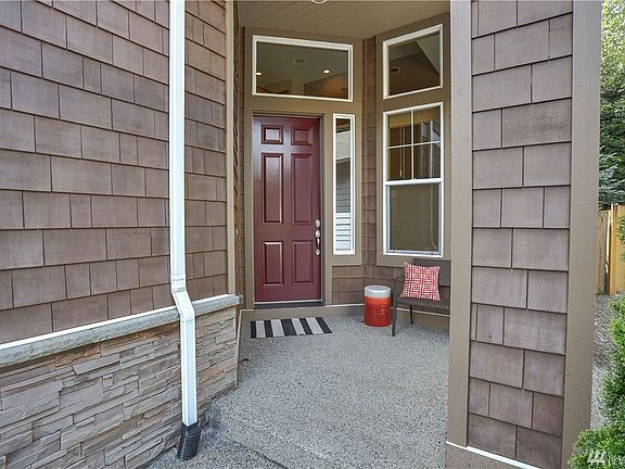 Beautiful craftsman design delivers from the moment you walk into this home with vaulted ceilings, an abundance of natural light, gorgeous hardwood floors, and large picture windows!  Notice the beautiful rockwork and the impressive two-story covered front entrance!