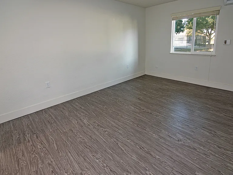 Comfortable bedroom with plenty of space and a large window.