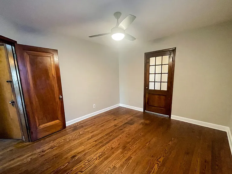 Bedroom view of the entry door and side room door.