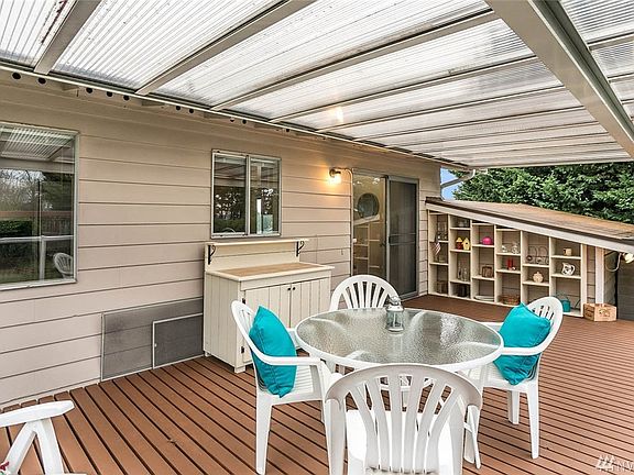 A fabulous covered deck welcomes you to extend your living and entertaining space outside to the large backyard. The master bedroom offers its own half bath. The front yard is landscaped with gorgeous ornamental trees. This well established neighborhood is situated in close proximity to freeways, SeaTac airport, hospital, major retail, dining and business hubs. 