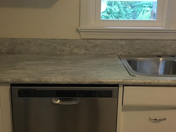 New kitchen counter top, double sink, and Whirlpool dishwash