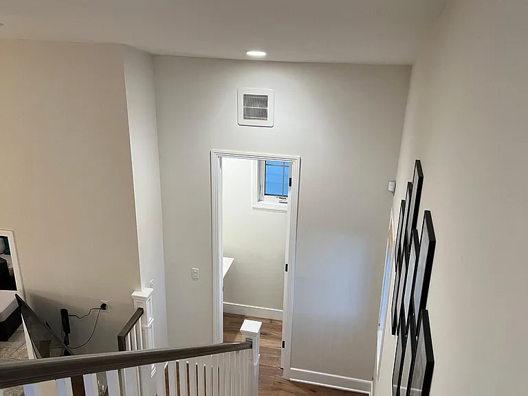 Staircase Looking into Powder Room / Half Bathroom