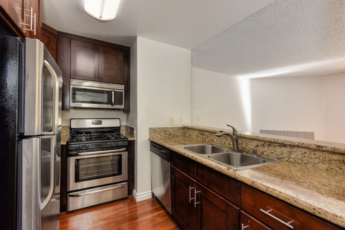 Kitchen with Countertops and Stainless Steel Appliances