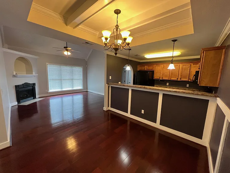 Dining, kitchen and den w fireplace