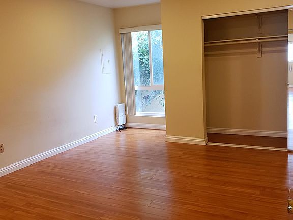 Master Bedroom with window and double closet. Master Bedroom has access to a Private Rooftop Deck