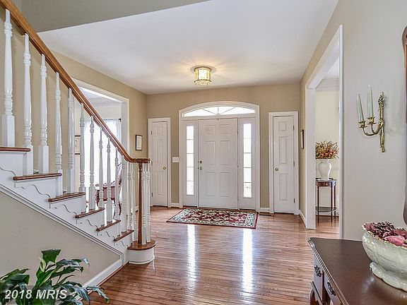 Welcoming Foyer with Glistening Hardwoods