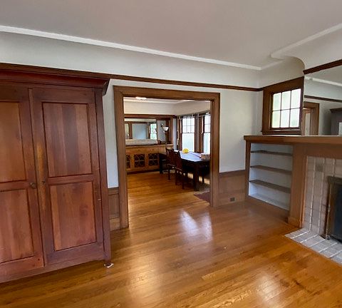 Living room and dining room have original gum wood paneling.