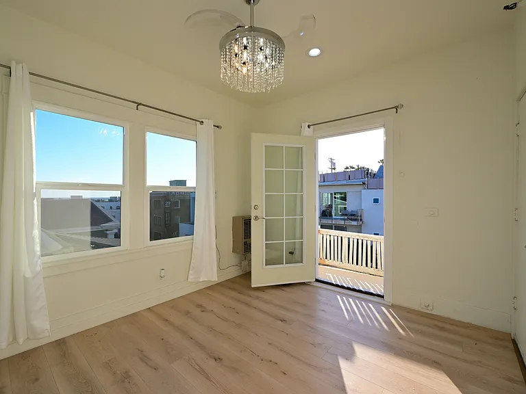 Cute top-floor fully upgraded studio unit w/ ocean views and in-unit laundry- direct door to private balcony