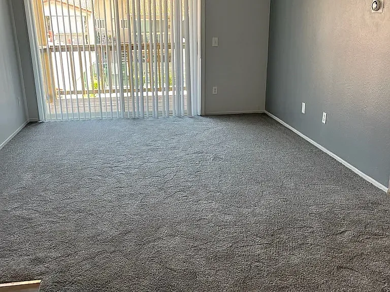 Large livingroom with a private balcony or private patio