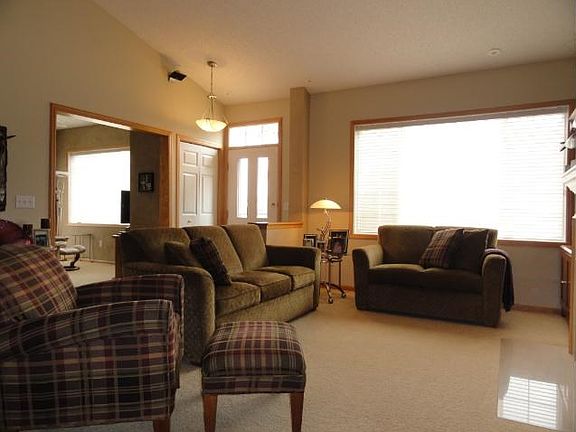 The livingroom has the Fireplace for those cozy evenings! Shelf above has lighting. Custom blinds in