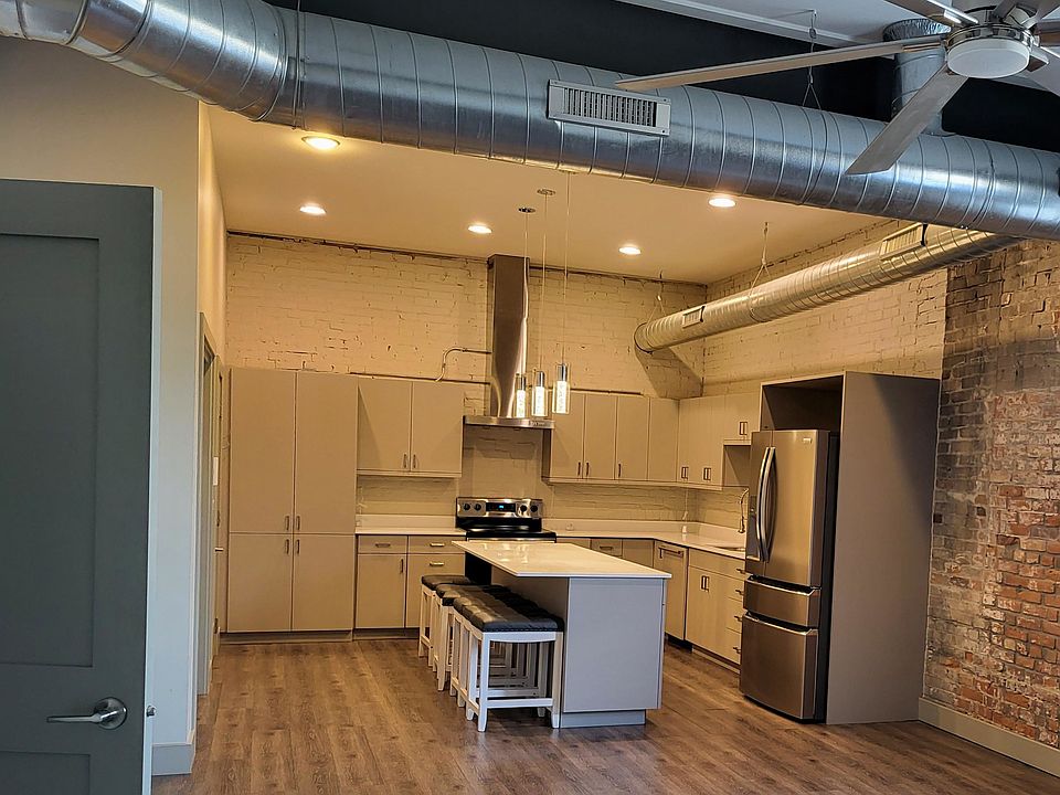 kitchen - includes refrigerator, stove, dishwasher, microwave. garbage disposal, built in pantry, island and barstools