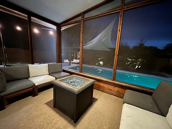 Porch seating, fire table, ceiling fans, electrical outlets. This is our favorite "room" in the house. ;-)