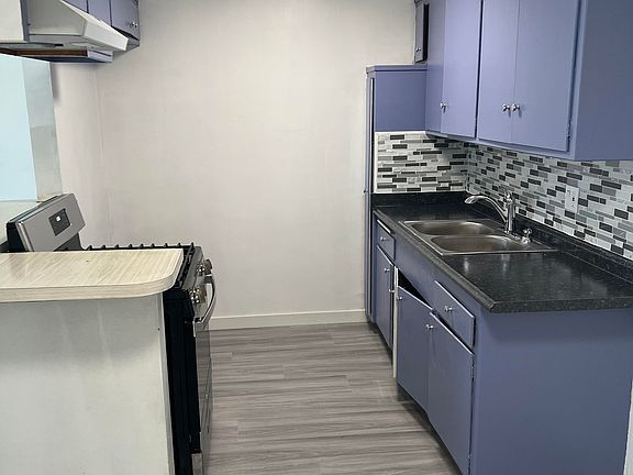 brand new kitchen counter top, brand new sink, new faucet, new garbage disposal, new back splash