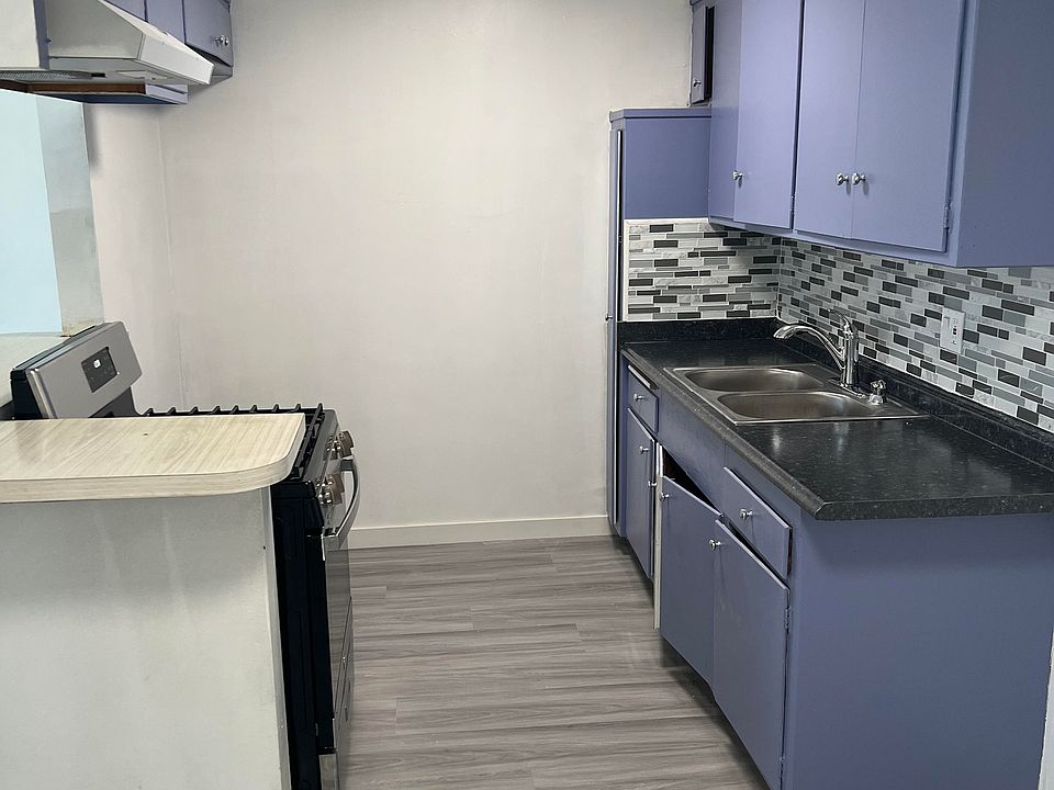 brand new kitchen counter top, brand new sink, new faucet, new garbage disposal, new back splash