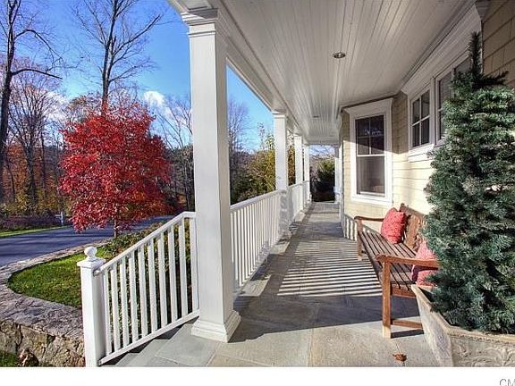 Watch the kids in the driveway by the covered porch!