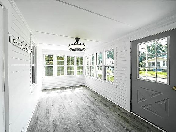 Front door entrance into spacious sunroom